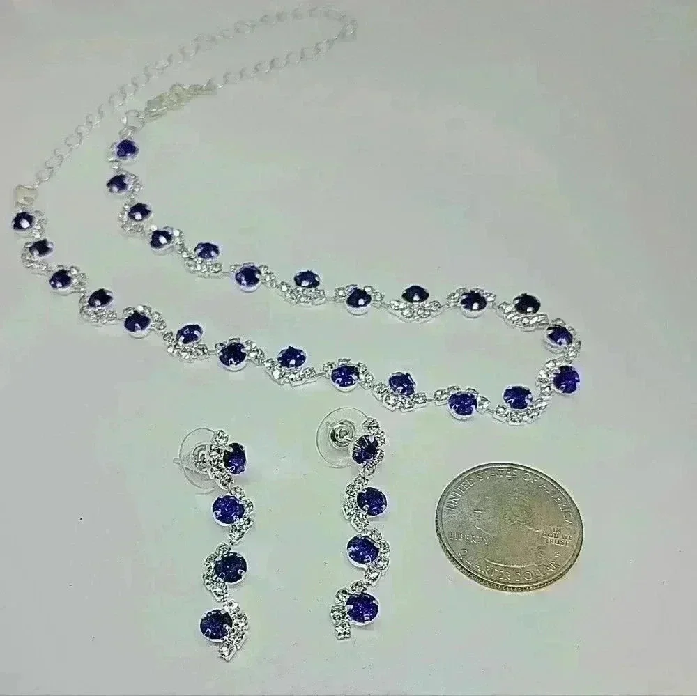 NWOT Stunning Wave Shape Blue Zircon And Crystal Necklace and Earrings S…